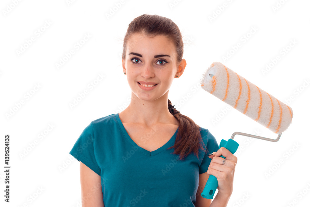 beautiful young girl in uniform makes renovation isolated on white background beautiful young girl in uniform makes renovation isolated on white background