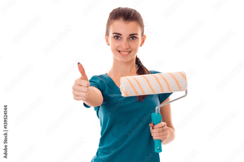 cheerful young girl in uniform makes renovation isolated on white background cheerful young girl in uniform makes renovation isolated on white background
