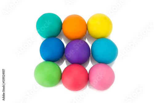 plasticine clay colorful ball rainbow on white background closeup © chercvc999