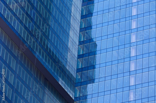 Modern skyscrapers with window reflections of blue sky