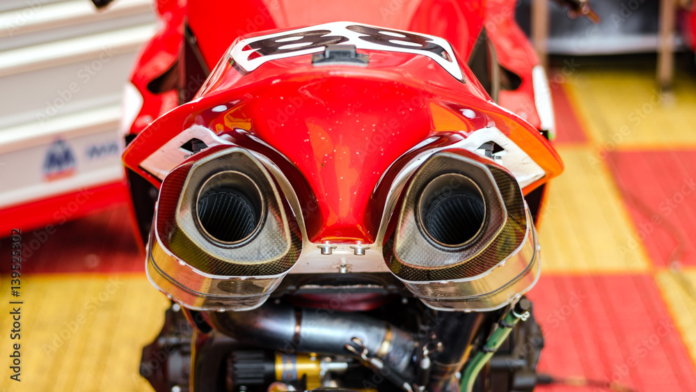 NIZHNY NOVGOROD, RUSSIA - JULY 14, 2013: Highway-ring motorcycle races. Exhaust pipes sports bike NIZHNY NOVGOROD, RUSSIA - JULY 14, 2013: Highway-ring motorcycle races. Exhaust pipes sports bike