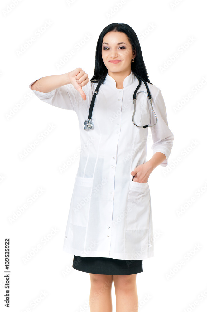 Unhappy medical doctor woman with stethoscope giving thumbs down hand gesture, isolated on white background Unhappy medical doctor woman with stethoscope giving thumbs down hand gesture, isolated on white background