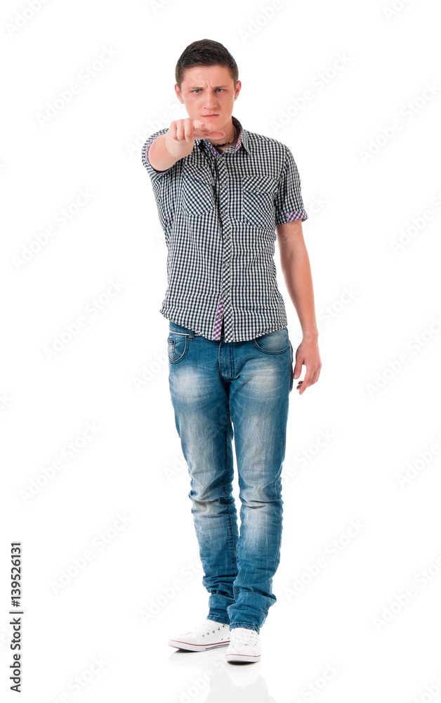 Teen boy pointing at camera choosing you, isolated on white background. Caucasian young man pointing finger to you. Teen boy pointing at camera choosing you, isolated on white background. Caucasian young man pointing finger to you.