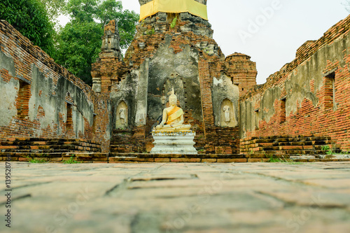 Ancient Buddha in Wat Choeng Tha in Ayuttha province, Thailand. photo