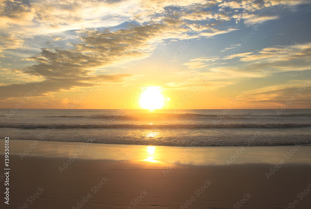 Sunrise on the beach with wave,Thailand