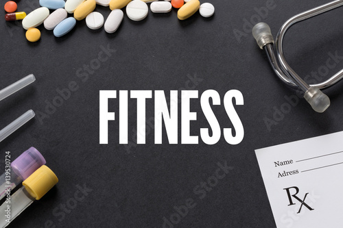 FITNESS written on black background with medication photo