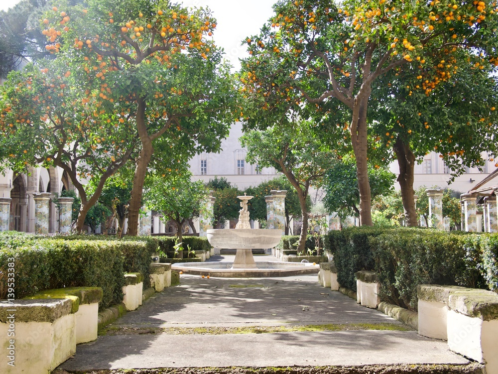 Pathway through a formal garden with fountain