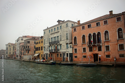 Scenic canals and bridges of foggy Venice  Italy