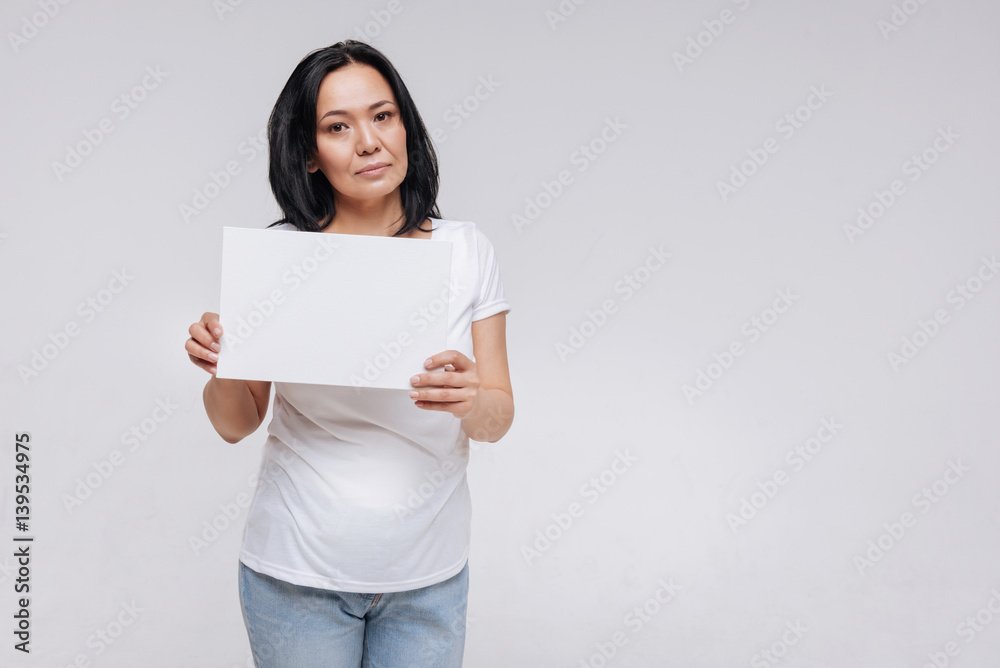 Strong ambitious woman showing the white sign Strong ambitious woman showing the white sign