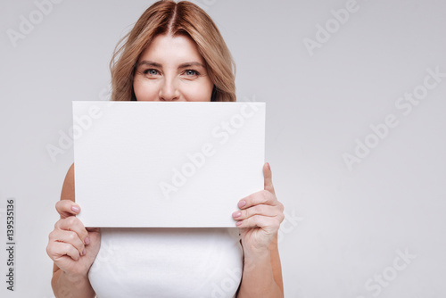 Remarkable bright woman hiding her smile