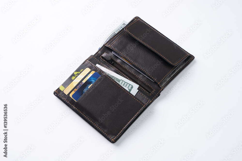 Open brown leather wallet with dollar cash, coins, debit credit cards isolated on white background Open brown leather wallet with dollar cash, coins, debit credit cards isolated on white background
