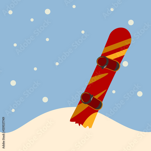 snowboard standing in snow