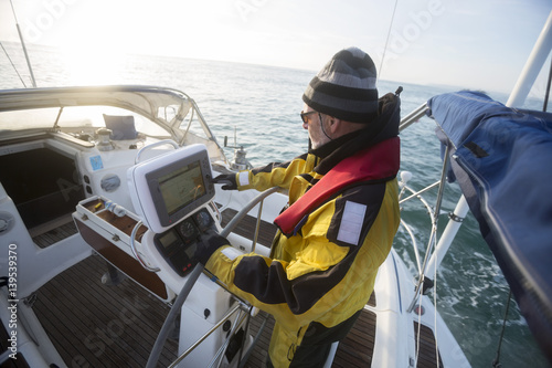 Εκτύπωση καμβά Man Operating Navigational Screen On Sail Boat In Sea