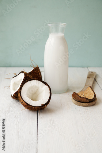 Coconut  milk on a light wooden background