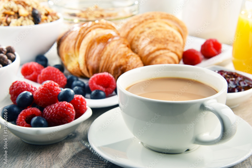 Breakfast served with coffee, juice, croissants and fruits Breakfast served with coffee, juice, croissants and fruits