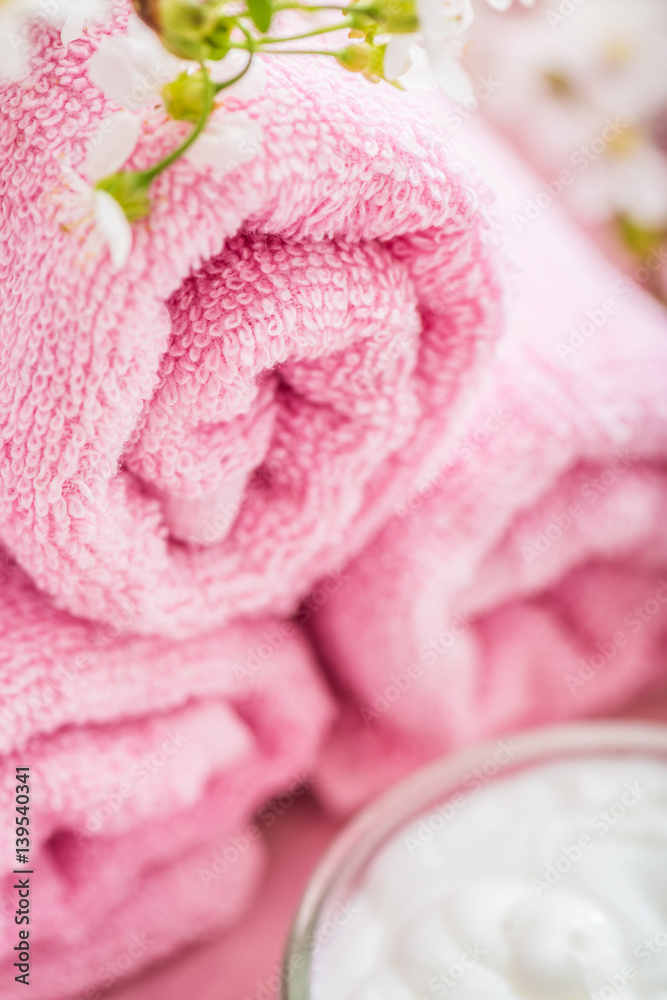 Rolled pink towel with flowers Rolled pink towel with flowers