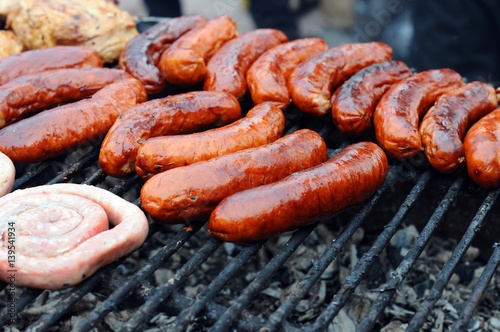 Fresh grilled sausages and welts in heap. Heap of Fresh sausage. Fresh grilled sausages and welts in heap. Close up