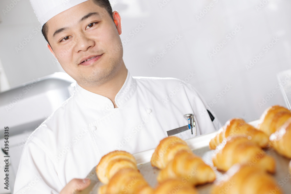 young man chelf makes bread in kitchen young man chelf makes bread in kitchen