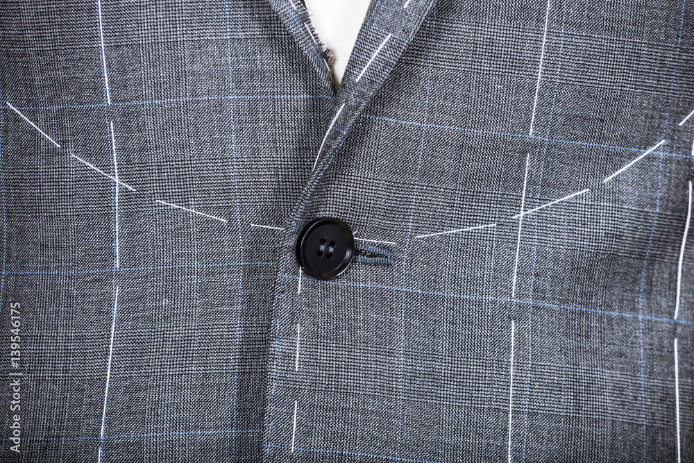 Details of a tailored suit jacket