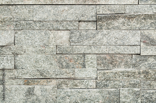 Grey stone wall tiles texture.wall pattern design or abstract background.