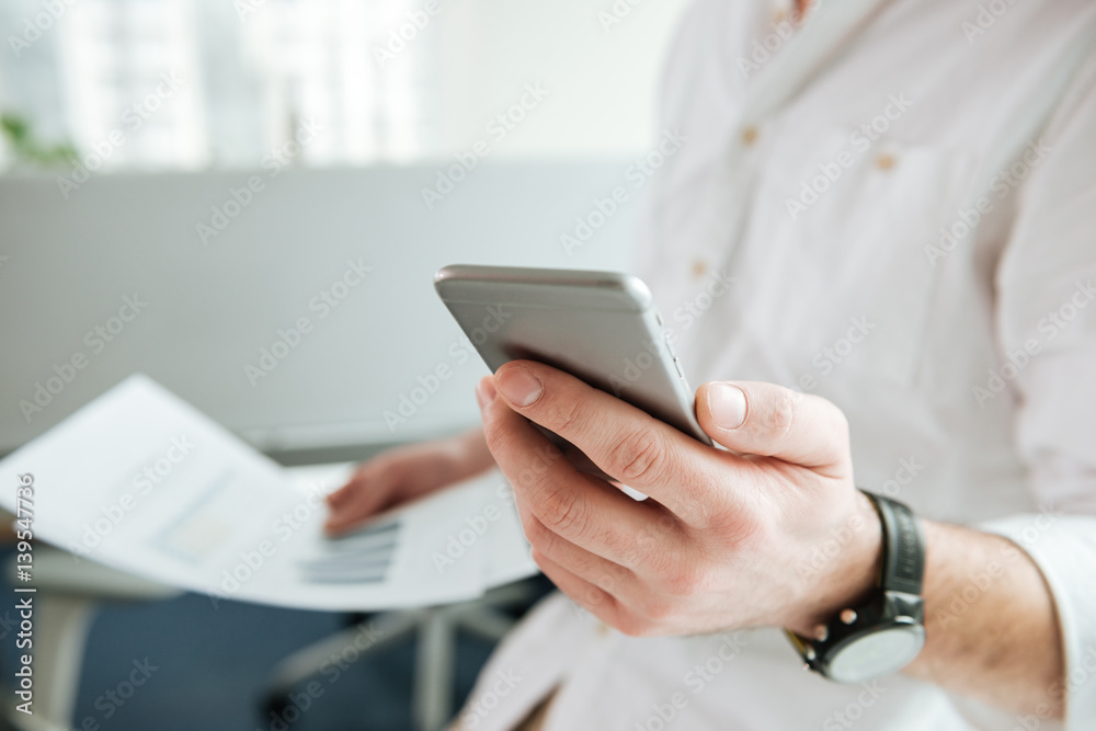 Cropped image of man using phone Cropped image of man using phone
