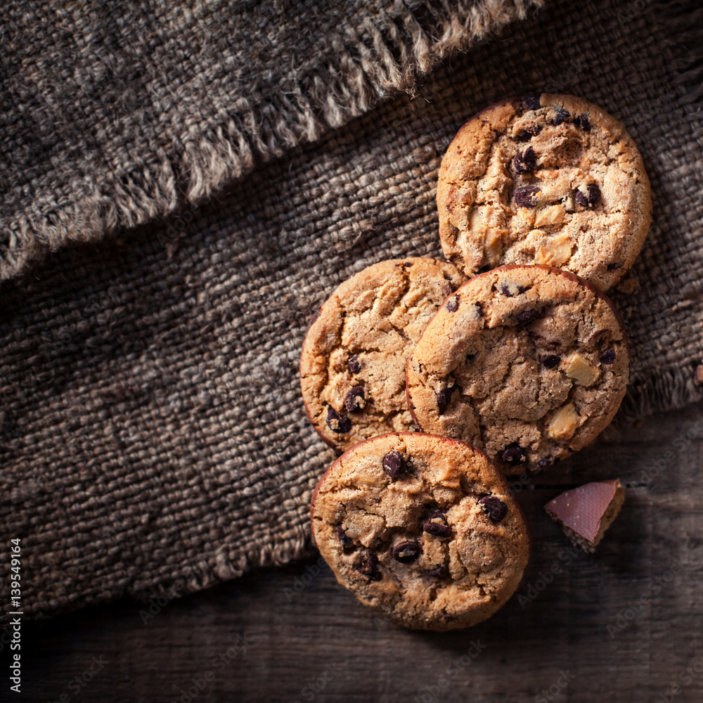 Chocolate chip cookies, freshly baked on rustic wooden table. Selective Focus. Copy space. Chocolate chip cookies, freshly baked on rustic wooden table. Selective Focus. Copy space.