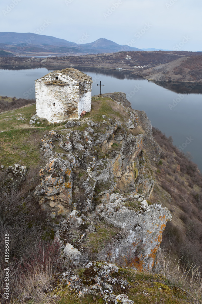 Φωτογραφία The small Orthodox church of Saint Ivan Letni from year 1350 perched on top of r