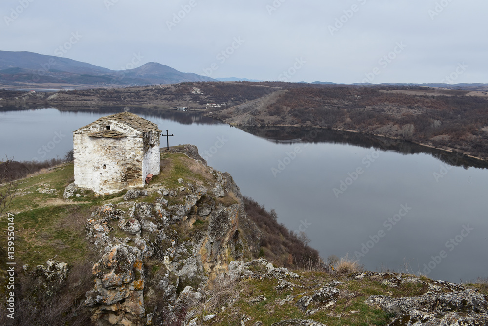 Φωτογραφία The small Orthodox church of Saint Ivan Letni from year 1350 perched on top of r