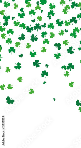 Flying leaves of clover different shades of green on a white background. Pattern for St. Patrick's Day. Rectangular, narrow, vertical banner. Vector illustration with copy space