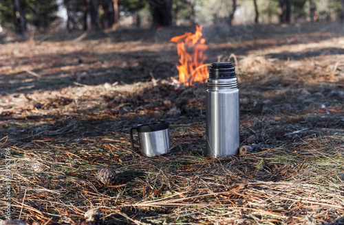 A thermos ,Coffee break in the forest