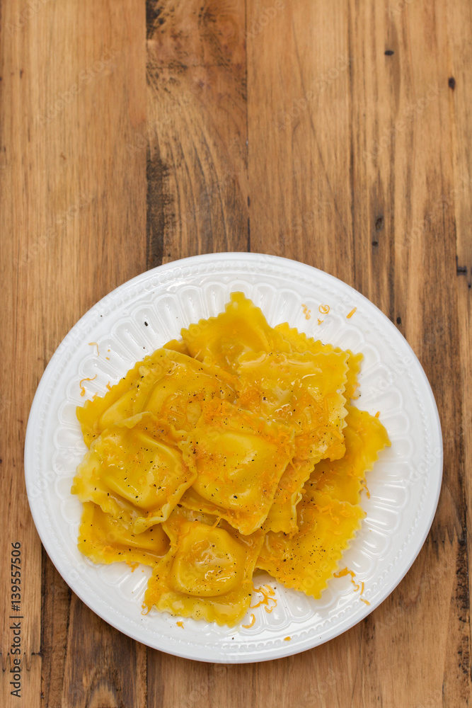 boiled ravioli with cheese on white plate boiled ravioli with cheese on white plate