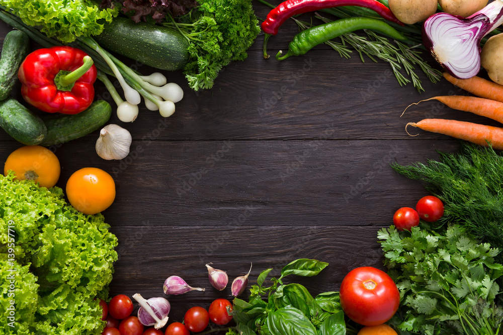 Frame of fresh vegetables on wooden background with copy space Frame of fresh vegetables on wooden background with copy space