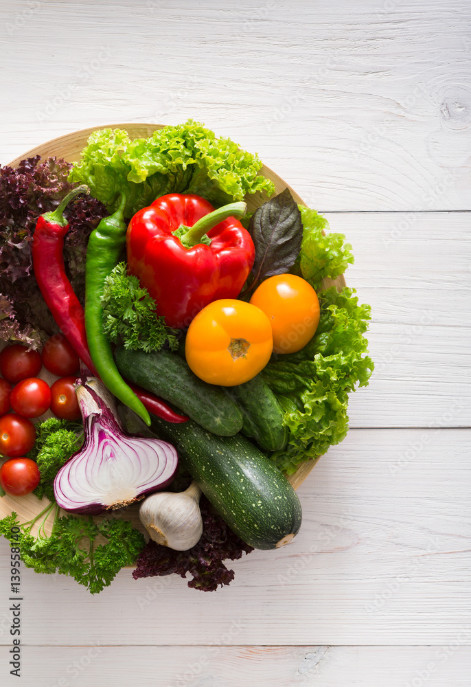 Border of fresh vegetables on wooden background with copy space Border of fresh vegetables on wooden background with copy space