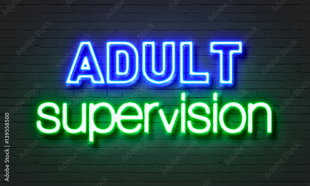 Adult supervision neon sign on brick wall background. Adult supervision neon sign on brick wall background.