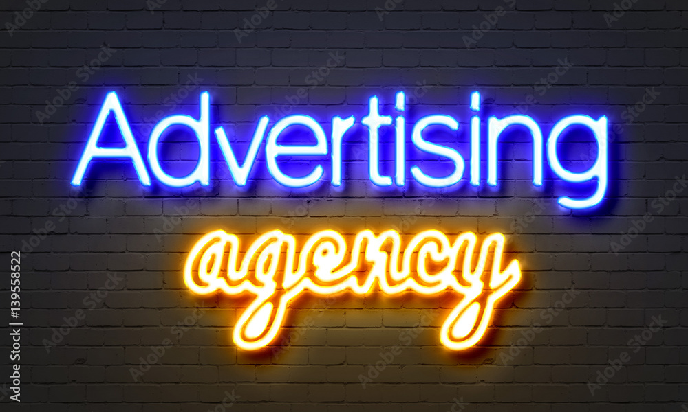 Advertising agency neon sign on brick wall background. Advertising agency neon sign on brick wall background.