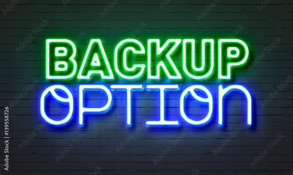 Backup option neon sign on brick wall background.