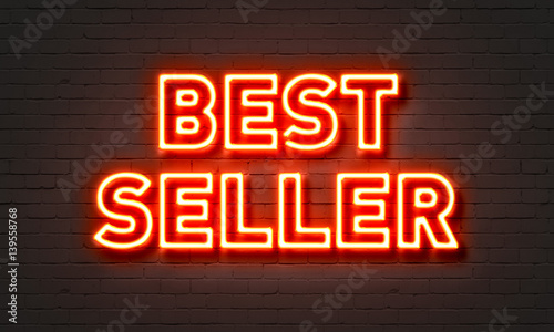 Bestseller neon sign on brick wall background. photo