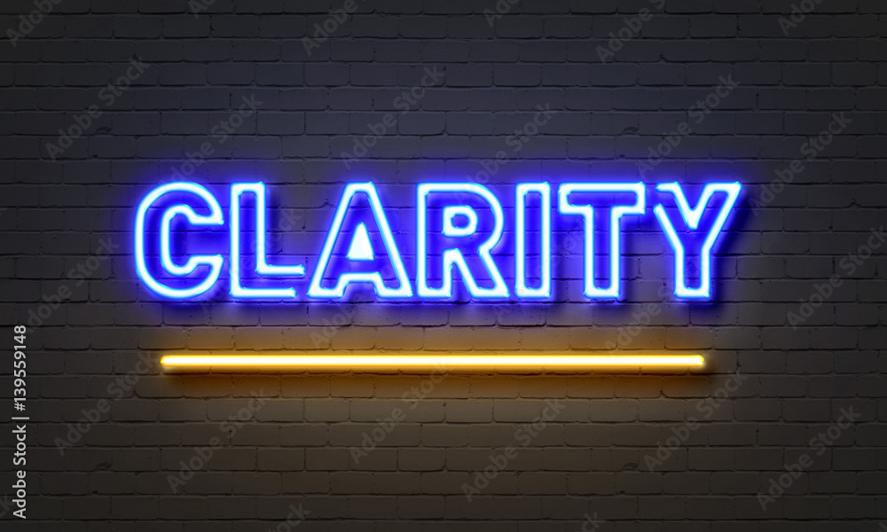 Clarity neon sign on brick wall background.