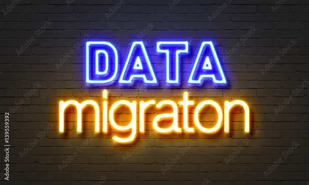 Obraz premium Data migration neon sign on brick wall background.