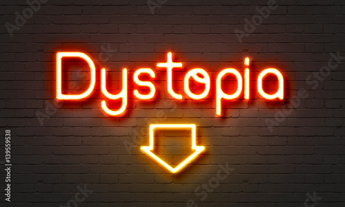 Dystopia neon sign on brick wall background. photo