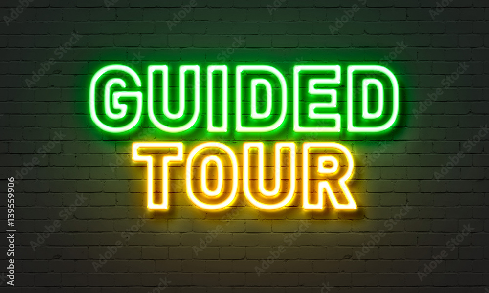 Guided tour neon sign on brick wall background. - obrazy, fototapety, plakaty 