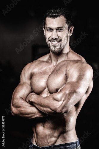 Sexy portrait of a muscular shirtless male model looking away © antondotsenko