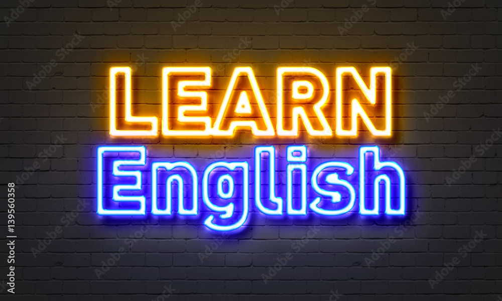 Learn English neon sign on brick wall background. Learn English neon sign on brick wall background.