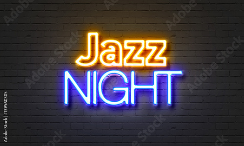 Photography Jazz night neon sign on brick wall background.