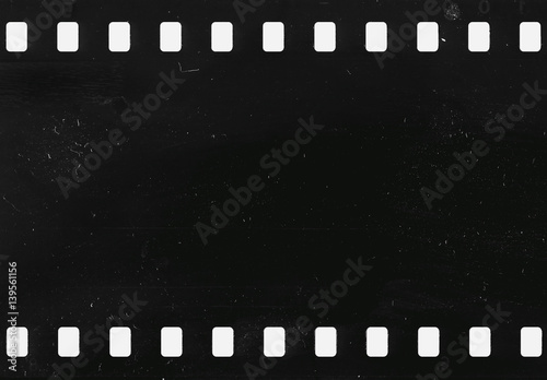Strip of old celluloid film with dust and scratches