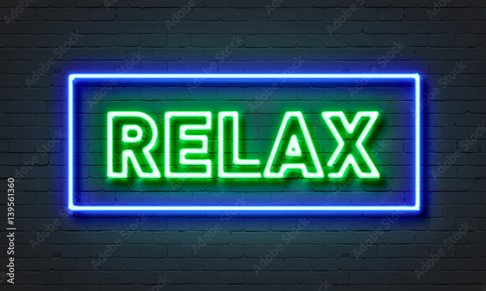 Obraz premium Relax neon sign on brick wall background.