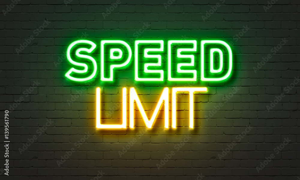 Speed limit neon sign on brick wall background. Speed limit neon sign on brick wall background.