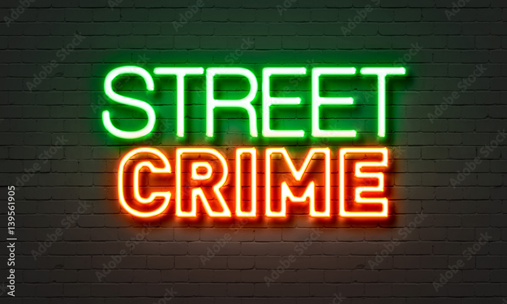 Street crime neon sign on brick wall background. Street crime neon sign on brick wall background.