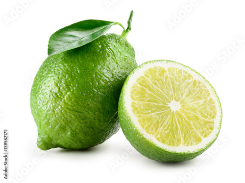 Lime. Fresh fruit with leaf isolated on white background. Whole and a half.