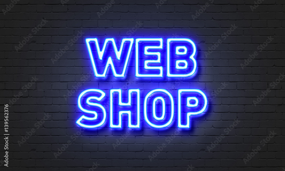 Web shop neon sign on brick wall background.